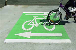 Green block safety marking across a driveway