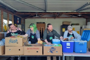 Image of people packing food at Kai Hub