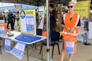 Lynne Vinsen collects Whanganui Mayoral  Relief Fund donations in aid of Cyclone  Gabrielle recovery at the Whanganui River  Markets on Saturday, 5 March