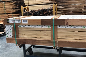 A pallet of treated wood in a factory 