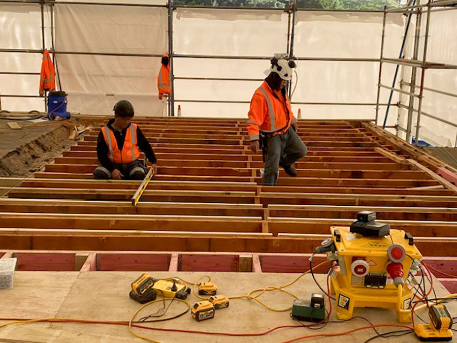 Airport terminal reroof - internal view showing W & W Construction workers