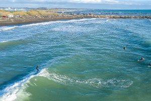 Surfers surfing at the North Mole